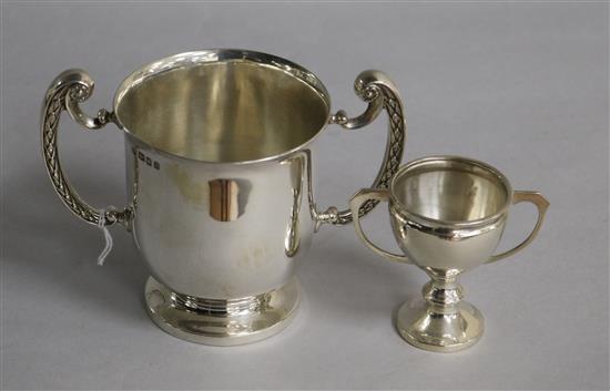 A George V silver two handled loving cup, Blackmore & Fletcher Ltd, London, 1919 and a small silver two handled trophy cup.